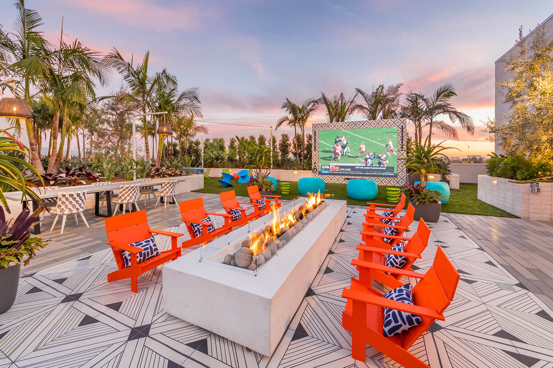 The rooftop terrace fire pit and outdoor movie screen at the Vita Apartment Homes in Orange, California.